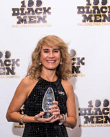 woman holding achievement award
