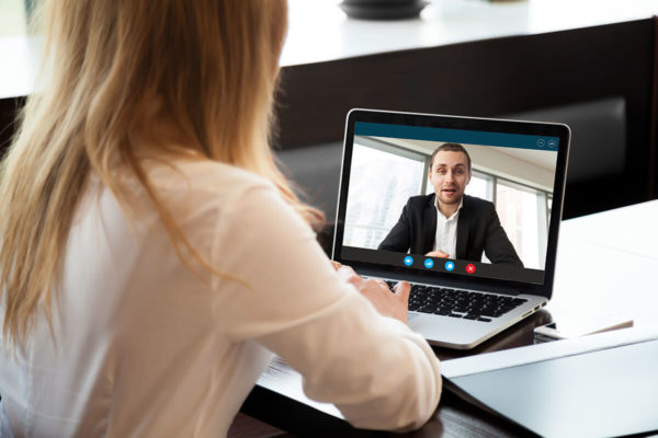 man and woman video conference
