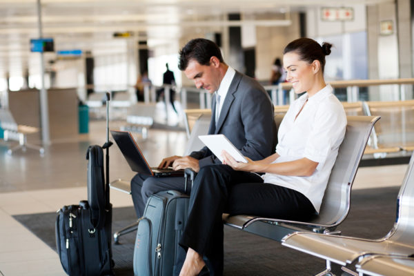 Business travelers working in airport