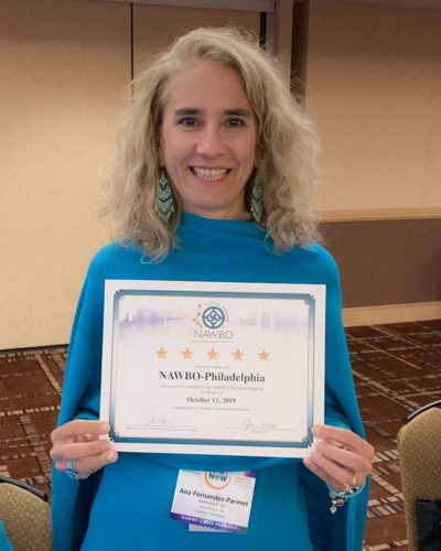 Parmetehc & NAWBO Philly chapter president, Ana Fernandez-Parmet is holding the certificate awarding the chapter 5 Star status she received at the WBC.