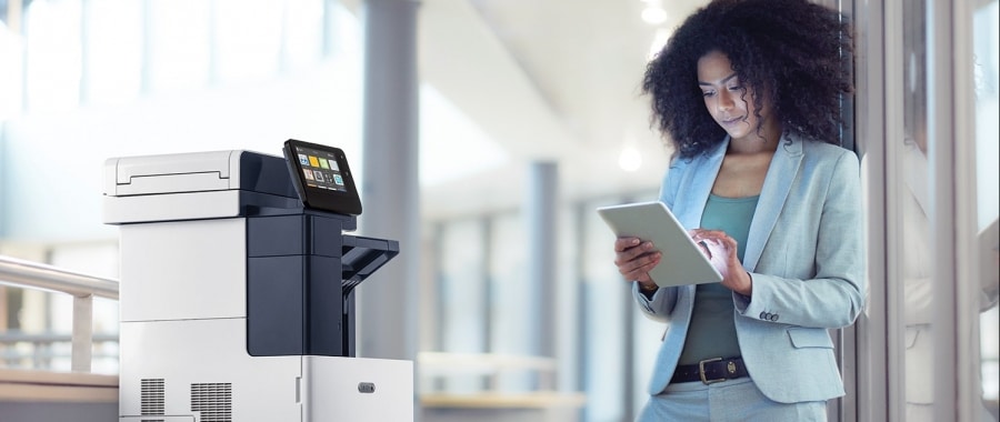 woman using her tablet to print from Xerox printer